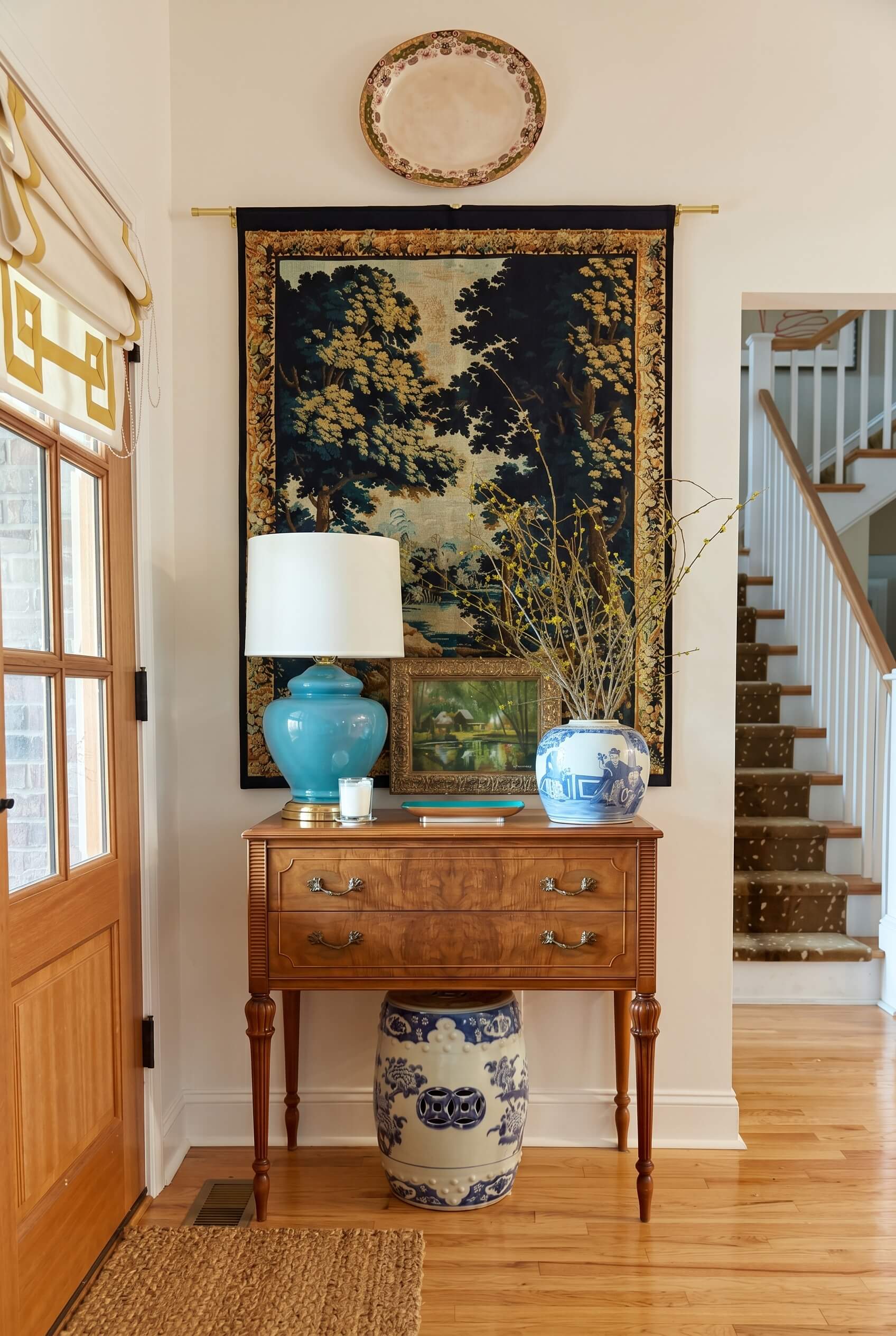 How to Decorate the Wall Above Your Fireplace or Entranceway Table